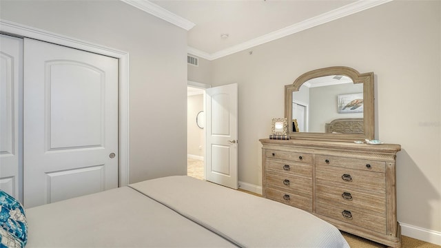 606 Riviera Dunes Way Unit 306, Palmetto, FL 34221 - bedroom featuring baseboards and ornamental molding