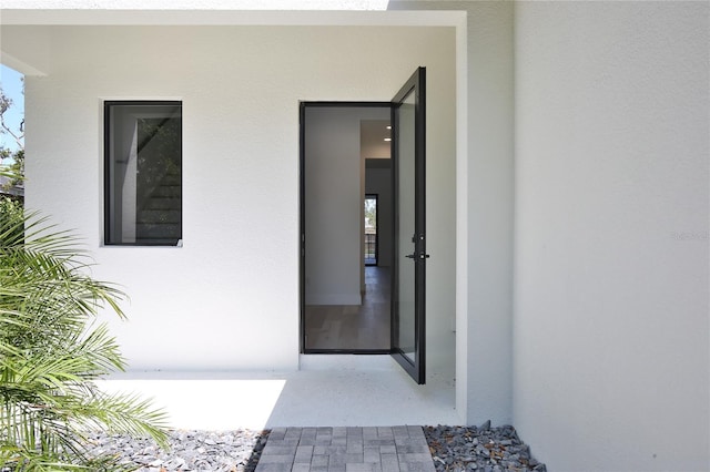 2335 Oak Ter, Sarasota, FL 34231 - doorway to property featuring stucco siding