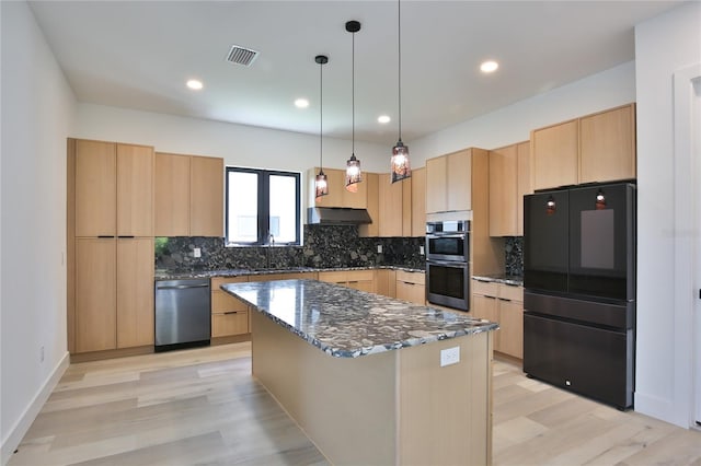 2335 Oak Ter, Sarasota, FL 34231 - kitchen featuring black appliances, light brown cabinetry, under cabinet range hood, tasteful backsplash, and light wood-type flooring