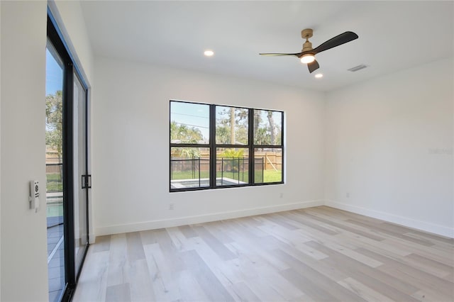 2335 Oak Ter, Sarasota, FL 34231 - unfurnished room with plenty of natural light, light wood-type flooring, recessed lighting, a ceiling fan, and baseboards
