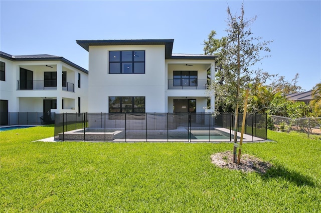 2335 Oak Ter, Sarasota, FL 34231 - back of property with a balcony, ceiling fan, stucco siding, and a patio