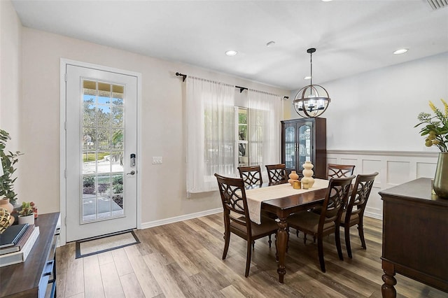 12149 Forest Park Cir, Bradenton, FL 34211 - dining room featuring a chandelier, wood finished floors, and recessed lighting