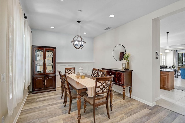 12149 Forest Park Cir, Bradenton, FL 34211 - dining room featuring light wood-type flooring, recessed lighting, a chandelier, and baseboards