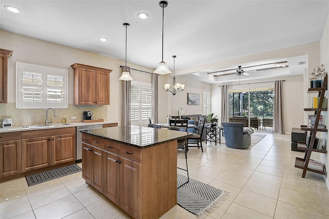 12149 Forest Park Cir, Bradenton, FL 34211 - kitchen featuring a sink, dishwasher, brown cabinetry, recessed lighting, and a center island