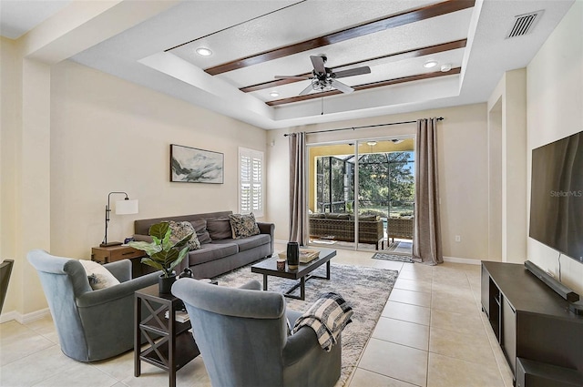 12149 Forest Park Cir, Bradenton, FL 34211 - living area with a tray ceiling, a ceiling fan, light tile patterned floors, and baseboards