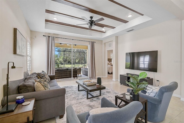 12149 Forest Park Cir, Bradenton, FL 34211 - living area with a raised ceiling, light tile patterned flooring, ceiling fan, baseboards, and recessed lighting
