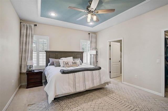 12149 Forest Park Cir, Bradenton, FL 34211 - carpeted bedroom featuring a raised ceiling, baseboards, and ceiling fan