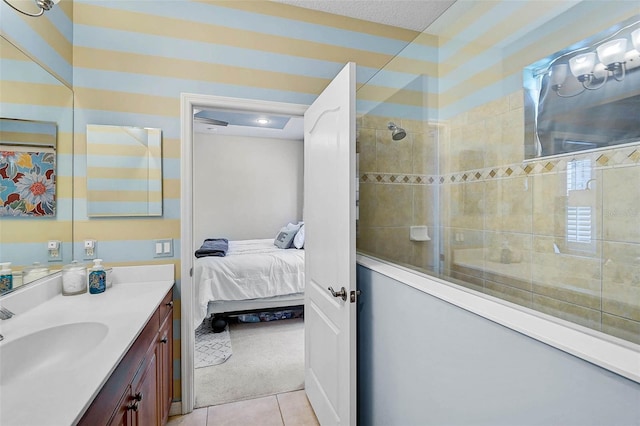12149 Forest Park Cir, Bradenton, FL 34211 - bathroom with vanity, a tile shower, tile patterned flooring, and ensuite bathroom