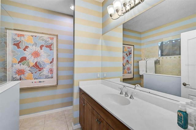 12149 Forest Park Cir, Bradenton, FL 34211 - bathroom featuring baseboards, vanity, tile patterned flooring, and wallpapered walls