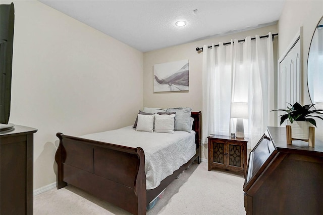 12149 Forest Park Cir, Bradenton, FL 34211 - bedroom with carpet floors, baseboards, recessed lighting, and a textured ceiling
