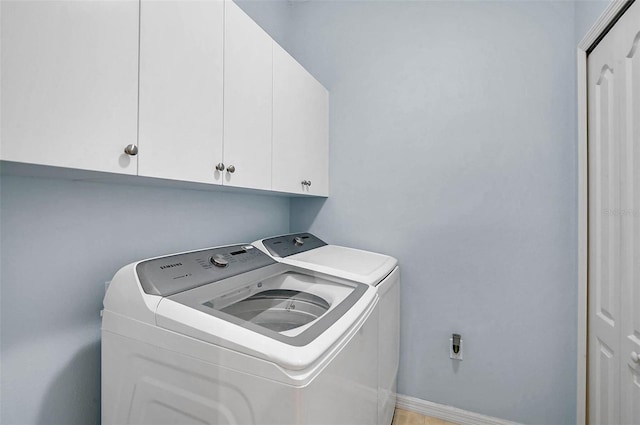 12149 Forest Park Cir, Bradenton, FL 34211 - laundry area featuring cabinet space, washer and dryer, and baseboards