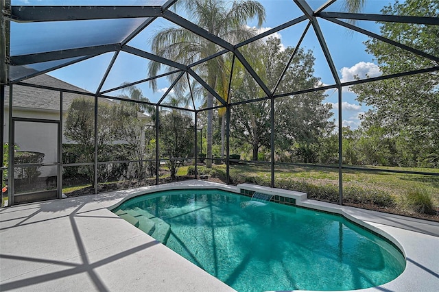 12149 Forest Park Cir, Bradenton, FL 34211 - outdoor pool featuring a patio, glass enclosure, and view of wooded area