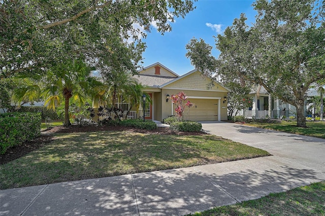 12149 Forest Park Cir, Bradenton, FL 34211 - view of front of property featuring an attached garage, concrete driveway, a front yard, and covered porch