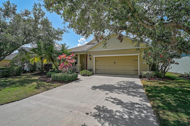 12149 Forest Park Cir, Bradenton, FL 34211 - single story home featuring driveway, a garage, a front yard, and stucco siding
