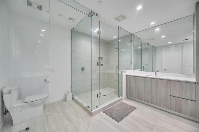 301 Quay Commons Unit 1711, Sarasota, FL 34236 - full bathroom with toilet, a shower stall, vanity, recessed lighting, and baseboards