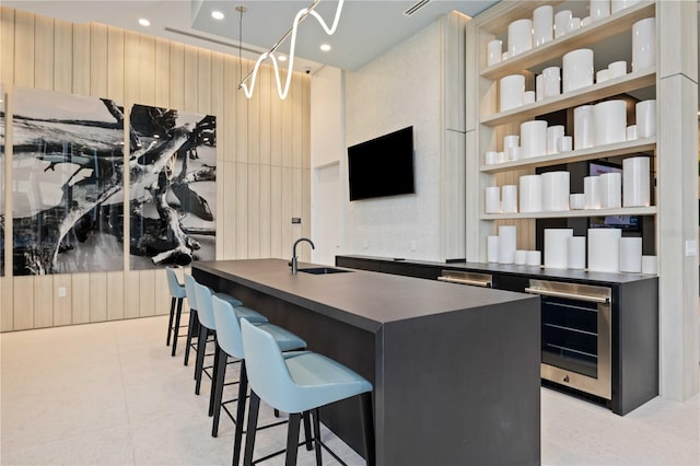 301 Quay Commons Unit 1711, Sarasota, FL 34236 - bar featuring a sink, beverage cooler, and recessed lighting