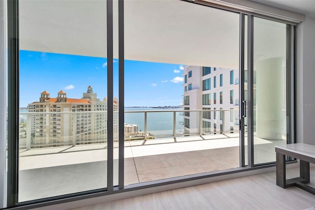 301 Quay Commons Unit 1711, Sarasota, FL 34236 - entryway with a water view, wood finished floors, and a city view