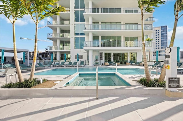 301 Quay Commons Unit 1711, Sarasota, FL 34236 - community pool featuring a community hot tub and a patio area