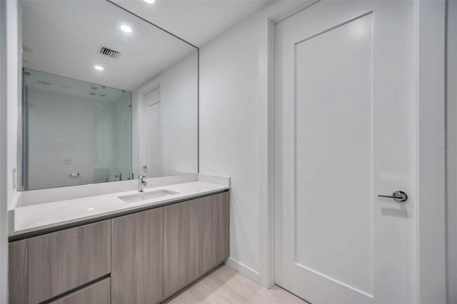 301 Quay Commons Unit 1711, Sarasota, FL 34236 - bathroom with vanity, recessed lighting, and wood finished floors