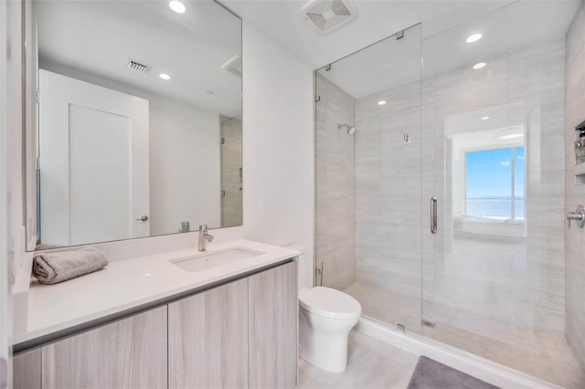 301 Quay Commons Unit 1711, Sarasota, FL 34236 - bathroom with toilet, a stall shower, vanity, and recessed lighting