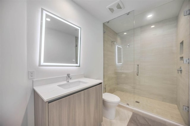 301 Quay Commons Unit 1711, Sarasota, FL 34236 - full bathroom featuring toilet, a stall shower, vanity, tile patterned flooring, and recessed lighting