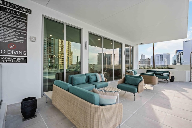 301 Quay Commons Unit 1711, Sarasota, FL 34236 - view of patio / terrace with an outdoor hangout area and a city view