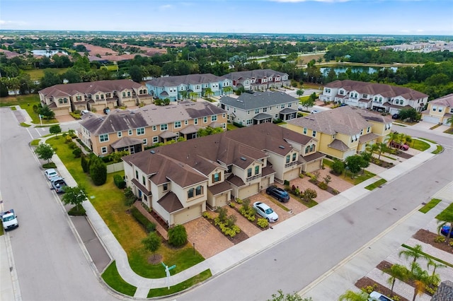 aerial perspective of suburban area featuring a nearby body of water