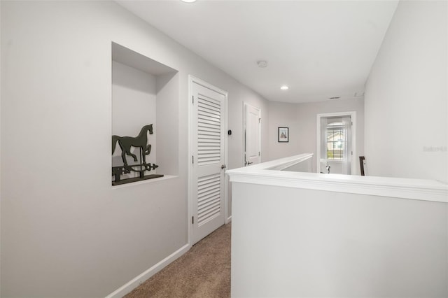 hall with carpet, recessed lighting, and baseboards