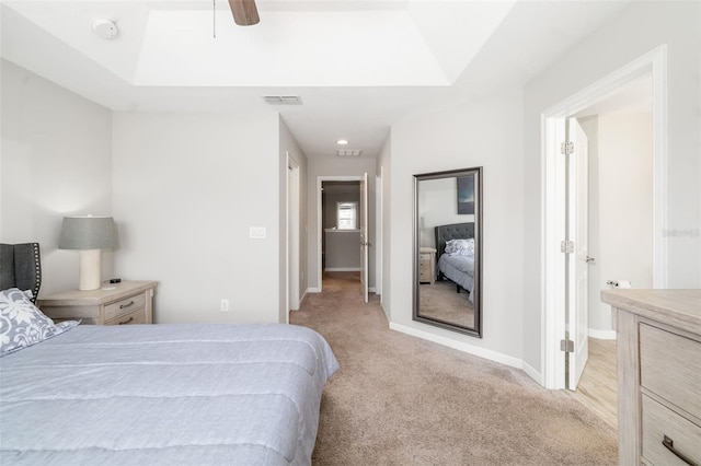 bedroom featuring light carpet, baseboards, and ceiling fan