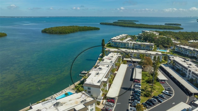 4420 Exeter Dr Unit L104, Longboat Key, FL 34228 - bird's eye view of a nearby body of water and a pool