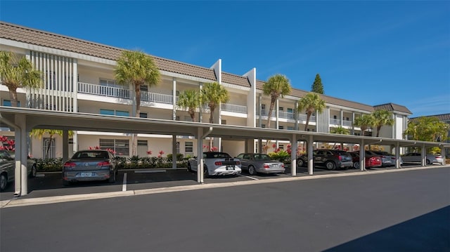 4420 Exeter Dr Unit L104, Longboat Key, FL 34228 - view of building exterior featuring covered parking