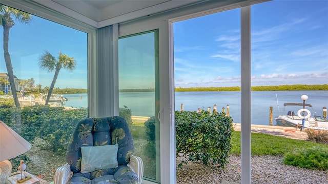 4420 Exeter Dr Unit L104, Longboat Key, FL 34228 - sunroom / solarium featuring a water view