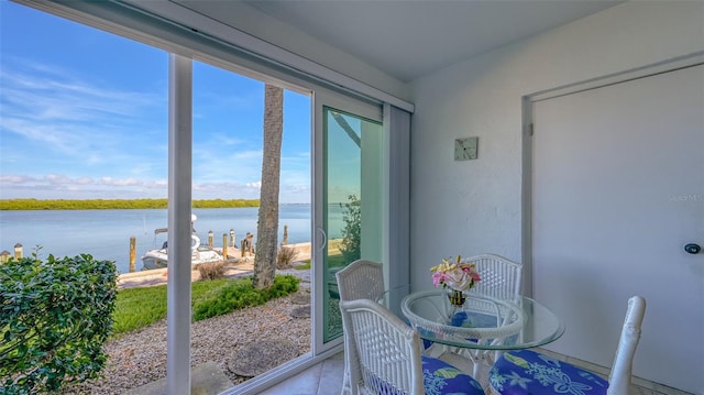 4420 Exeter Dr Unit L104, Longboat Key, FL 34228 - sunroom / solarium featuring a water view