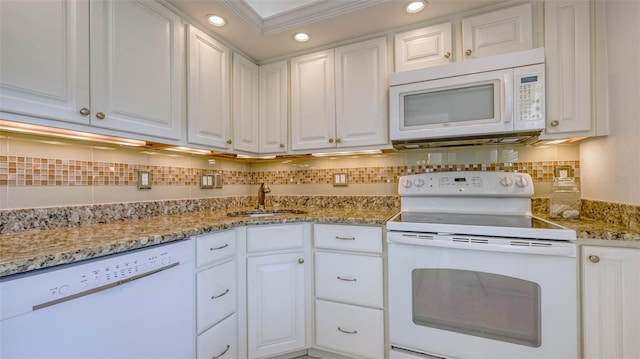 4420 Exeter Dr Unit L104, Longboat Key, FL 34228 - kitchen with white appliances, a sink, white cabinets, backsplash, and recessed lighting