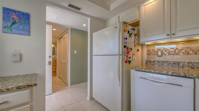 4420 Exeter Dr Unit L104, Longboat Key, FL 34228 - kitchen with white appliances, light tile patterned flooring, tasteful backsplash, light stone countertops, and recessed lighting