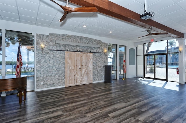 4420 Exeter Dr Unit L104, Longboat Key, FL 34228 - unfurnished living room featuring a ceiling fan, a barn door, wood finished floors, and recessed lighting