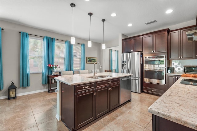 2745 62nd Ave E, Ellenton, FL 34222 - kitchen featuring a sink, stainless steel appliances, dark brown cabinets, light tile patterned floors, and recessed lighting