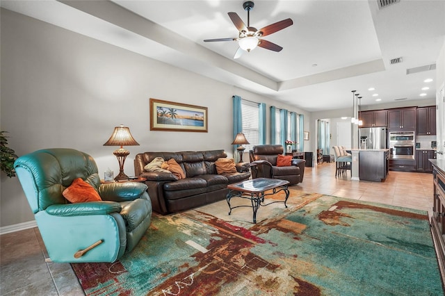 2745 62nd Ave E, Ellenton, FL 34222 - living area featuring ceiling fan, baseboards, light tile patterned floors, a raised ceiling, and recessed lighting