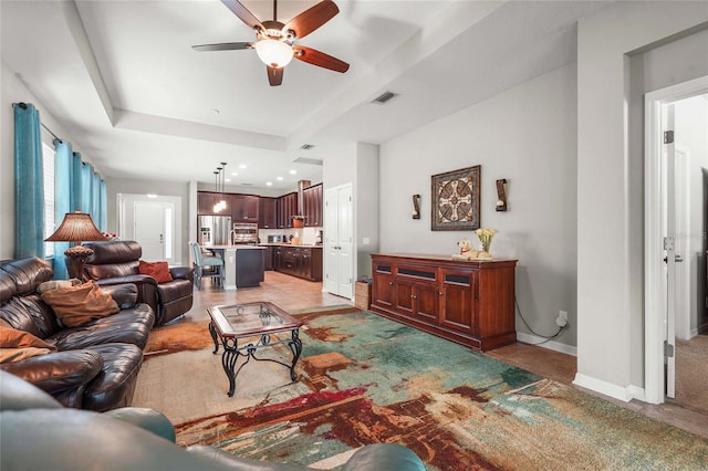 2745 62nd Ave E, Ellenton, FL 34222 - living area featuring a ceiling fan, baseboards, and a raised ceiling