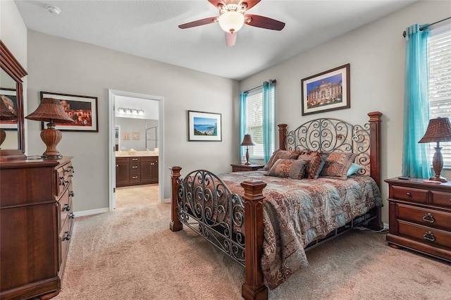2745 62nd Ave E, Ellenton, FL 34222 - bedroom featuring light colored carpet, ceiling fan, ensuite bathroom, and baseboards