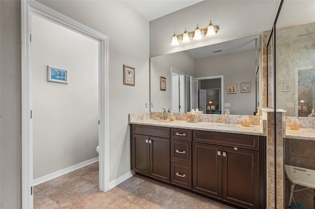 2745 62nd Ave E, Ellenton, FL 34222 - full bathroom featuring a stall shower, double vanity, baseboards, and toilet