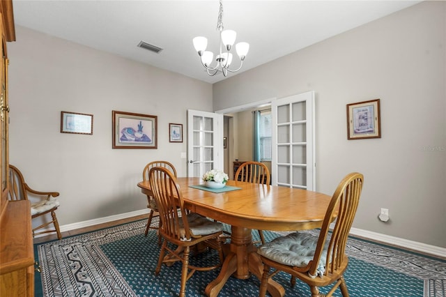 2745 62nd Ave E, Ellenton, FL 34222 - dining space featuring a chandelier, baseboards, and french doors