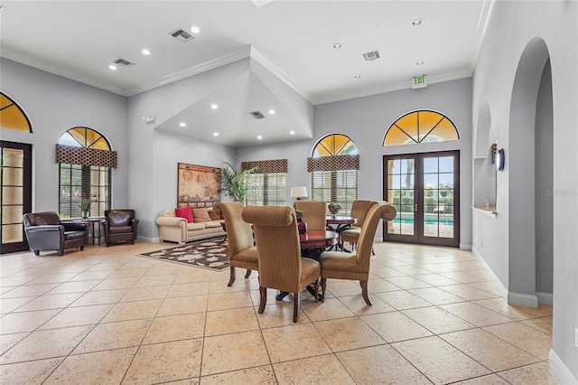 2745 62nd Ave E, Ellenton, FL 34222 - dining space with recessed lighting, baseboards, arched walkways, crown molding, and light tile patterned flooring