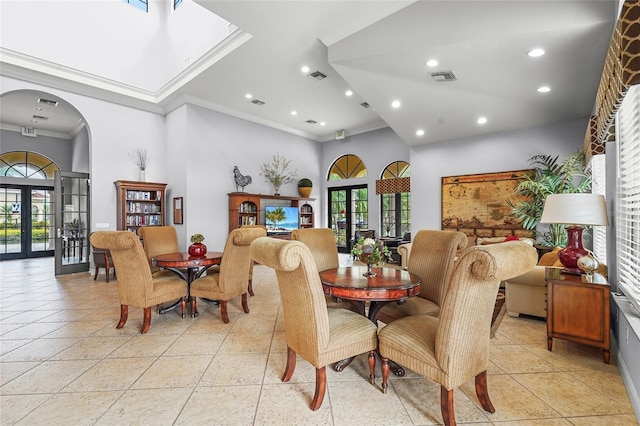 2745 62nd Ave E, Ellenton, FL 34222 - dining room featuring crown molding, french doors, arched walkways, plenty of natural light, and recessed lighting