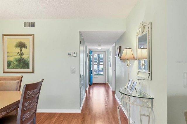 7301 29th Avenue Dr W Unit 108, Bradenton, FL 34209 - corridor with wood finished floors and baseboards