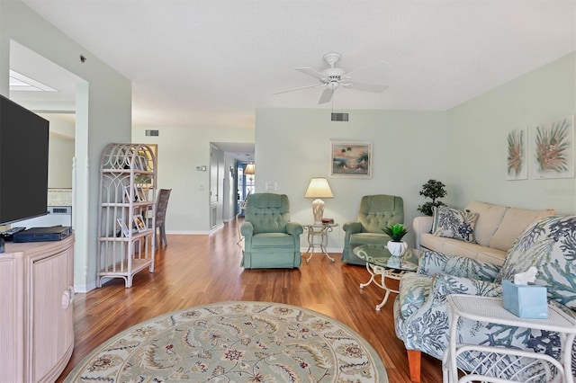 7301 29th Avenue Dr W Unit 108, Bradenton, FL 34209 - living area with a ceiling fan, wood finished floors, and baseboards