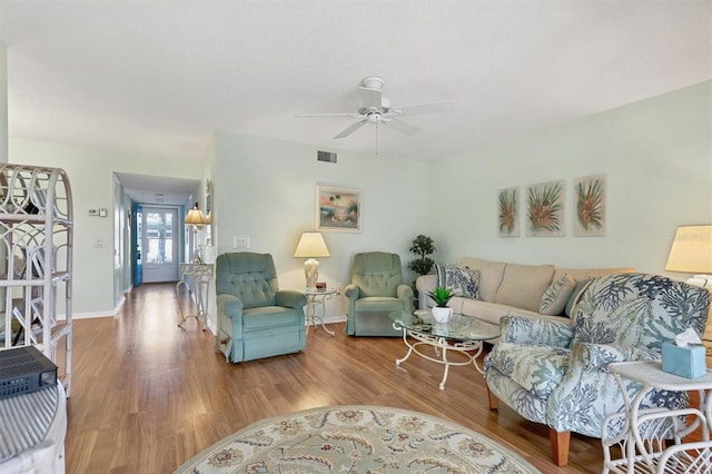 7301 29th Avenue Dr W Unit 108, Bradenton, FL 34209 - living room with wood finished floors, a ceiling fan, and baseboards