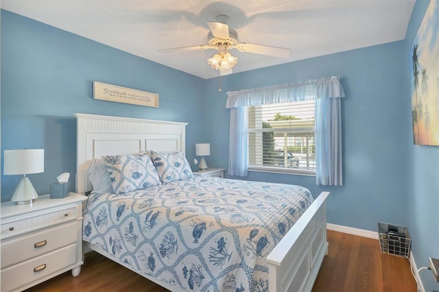 7301 29th Avenue Dr W Unit 108, Bradenton, FL 34209 - bedroom featuring dark wood-style flooring, baseboards, and ceiling fan