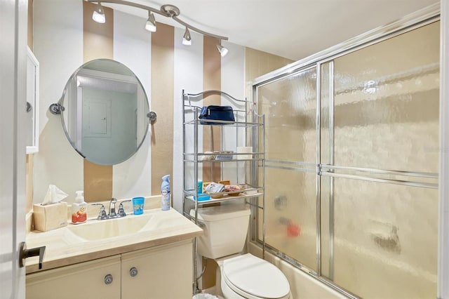 7301 29th Avenue Dr W Unit 108, Bradenton, FL 34209 - full bathroom with vanity, bath / shower combo with glass door, and toilet