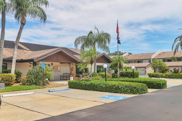 7301 29th Avenue Dr W Unit 108, Bradenton, FL 34209 - view of front facade with stucco siding and uncovered parking